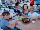 Family enjoying the St Demetrios Greek Fest in Elmhurst