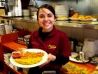 Friendly server with omelet at Annie's Pancake House in Skokie