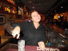 Friendly bar server at Andrew's Open Pit & Spirits in Park Ridge Friendly bar server at Andrew's Open Pit & Spirits in Park Ridge