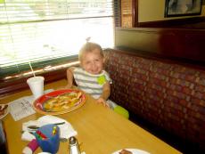 Youngster enjoying breakfast with her family at Canteen Restaurant in Barrington Youngster enjoying breakfast with her family at Canteen Restaurant in Barrington