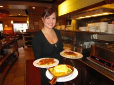 Friendly server with breakfast at Eggville Cafe in Cary Friendly server with breakfast at Eggville Cafe in Cary