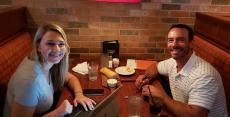 Couple enjoying dinner at Jameson's Charhouse in Arlington Heights Couple enjoying dinner at Jameson's Charhouse in Arlington Heights