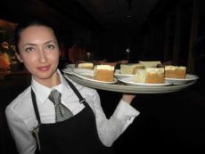 Friendly server with desserts at Jameson's Charhouse in Arlington Heights Friendly server with desserts at Jameson's Charhouse in Arlington Heights