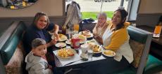 Family enjoying lunch at Les Brothers Restaurant in Oak Lawn Family enjoying lunch at Les Brothers Restaurant in Oak Lawn