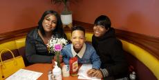 Family enjoying breakfast at Lumes Pancake House in Chicago Family enjoying breakfast at Lumes Pancake House in Chicago
