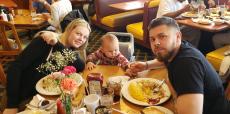 Family enjoying breakfast at Lumes Pancake House in Chicago Family enjoying breakfast at Lumes Pancake House in Chicago