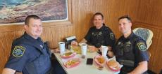 Police officers enjoying lunch at Nick's Drive In Restaurant Chicago Police officers enjoying lunch at Nick's Drive In Restaurant Chicago