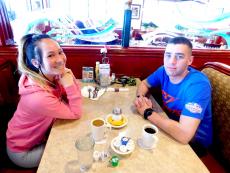 Young couple enjoying breakfast at Omega Restaurant & Pancake House in Downers Grove Young couple enjoying breakfast at Omega Restaurant & Pancake House in Downers Grove
