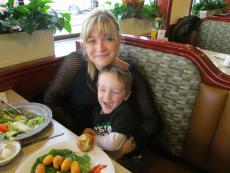 Mother and son enjoying lunch at Omega Restaurant & Pancake House in Downers Grove Mother and son enjoying lunch at Omega Restaurant & Pancake House in Downers Grove
