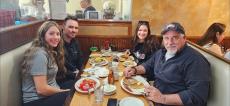 Family enjoying lunch at Tasty Waffle Restaurant in Romeoville
